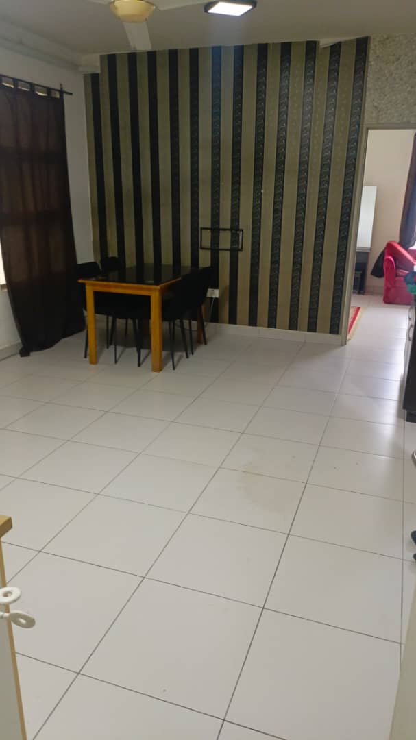 Dining area with a striped wall and tiled floor