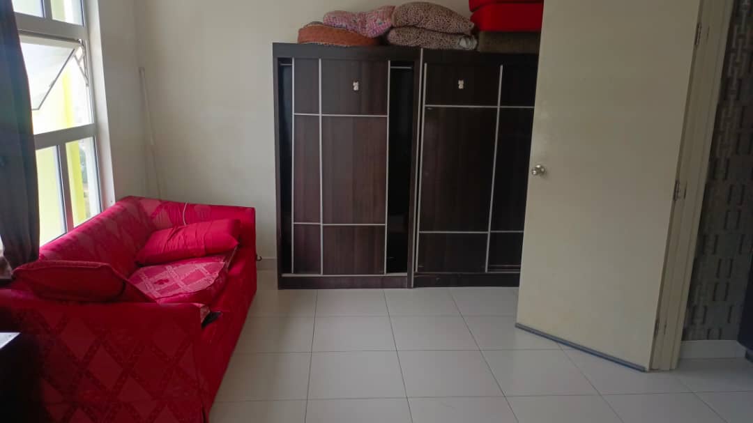 Living room with red sofa and wooden cabinet